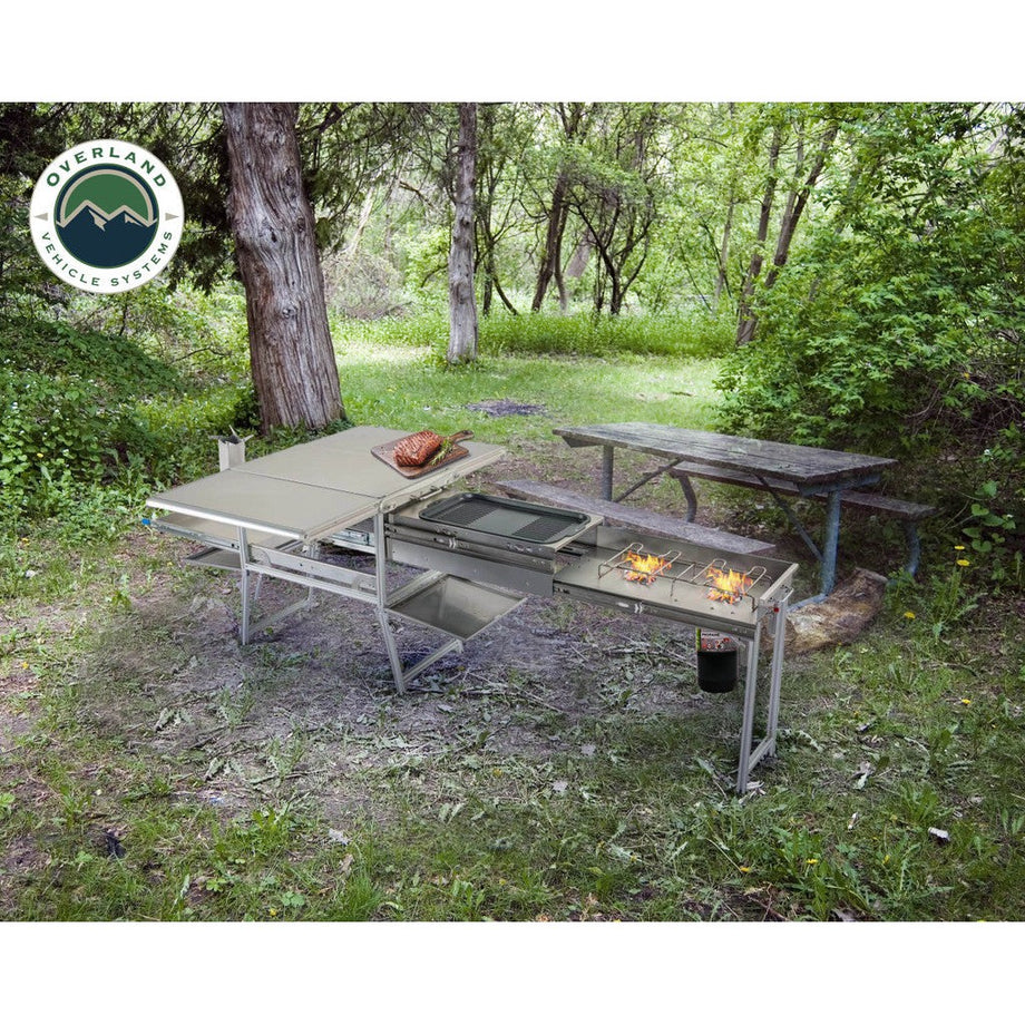 https://broncpartspro.com/cdn/shop/files/Komodo-Camp-Kitchen-Dual-Grill-Skillet-Folding-Shelves-and-Rocket-Tower-Stainless-Steel_460x@2x.jpg?v=1695443956